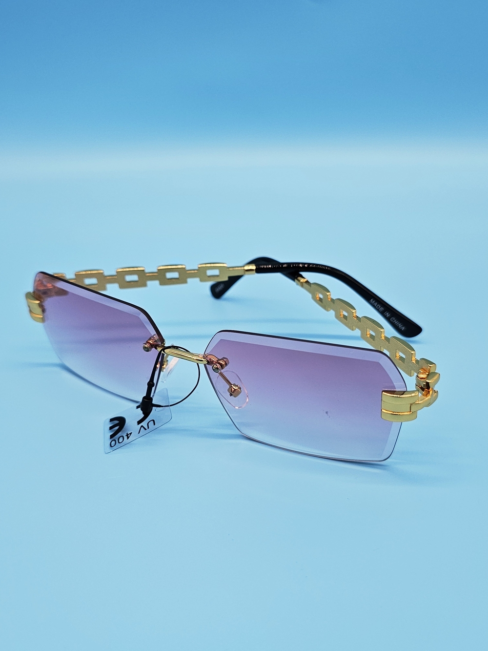 Gold-Chain Rimless Sunglasses with Purple Gradient Lenses